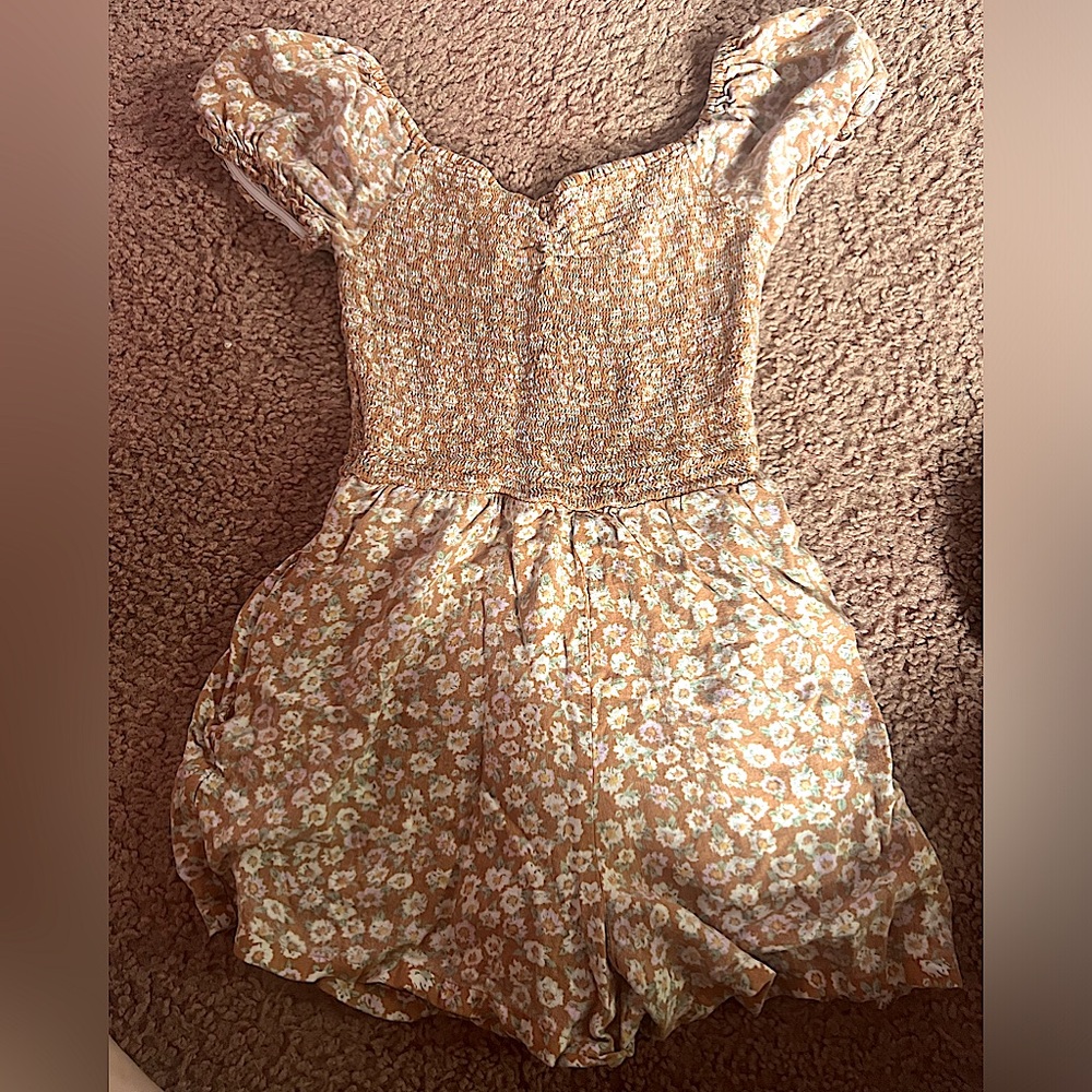 This is a romper, I’m not sure where it’s from. It’s an XS. Never worn